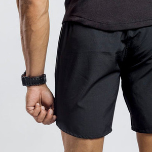 Men's <b>Black</b> Solid Quick Dry Breathable Sport Shorts Elastic Waist Knee Length Nonwoven Polyester Front Logo Drawstring Closure - Product Image 3