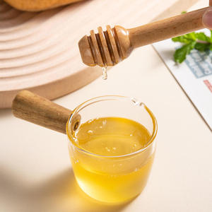 Bâtonnet à miel en bois naturel plaqué or rose, écologique et durable, avec long manche, pour pots de miel et cuisine - Product Image 1