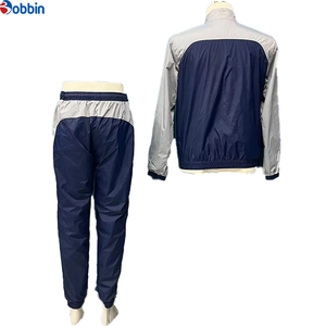 Conjunto Deportivo Personalizado para Hombre, Estilo Jogger, Color Azul Marino y Gris, Bloques de Color, Manga Larga, Cuello Alto, Cortavientos, Unisex - Product Image 1