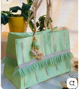 Elegant Mint Green Handcrafted Potli Tote Bag with Ruffled Detailing Golden Tassel Charm & Braided Handles for Festive Gifting - Product Image 2