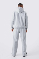 Ensemble de survêtement streetwear personnalisé délavé à l'acide, comprenant un sweat à capuche zippé et un pantalon de survêtement évasé avec patchs effet vieilli