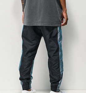 Pantalon de survêtement pour homme à blocs de couleur avec bande latérale, taille élastique et cordon de serrage, décontracté, respirant, en polyester, pour l'automne - Product Image 3