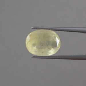 พลอยแซฟไฟร์สีเหลืองทรงรีขนาด 14x10.5 มม. น้ำหนัก 9.08 กะรัต ได้รับการรับรองจาก IGI แท้ 100% ผ่านการเคลือบแว็กซ์/น้ำมัน ปรับเปลี่ยนสีได้ คุณภาพดี - Product Image 1