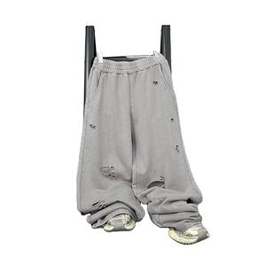 กางเกงวอร์มทรงตรงขาบานสไตล์วินเทจผ้าฟลีซหนานุ่มฟอกสีแบบกรดขาดๆ สำหรับผู้ชาย ทรงโอเวอร์ไซส์ สตรีทแวร์ - Product Image 1