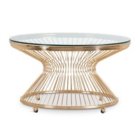 Table basse moderne en acier inoxydable doré avec plateau en verre et base ronde sur roulettes pour salon