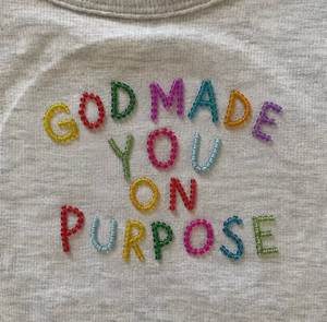 Camiseta de algodón hecha a mano con cuentas y diseño de letras coloridas, con la frase 'God Made You On Purpose' - Product Image 1