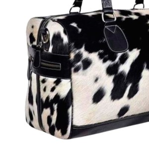 กระเป๋าเดินทางหนังวัวแท้ลายขนสัตว์ รุ่นใหม่ ปี 2026  กระเป๋าสะพายข้างแฟชั่นสำหรับเดินทางช่วงสุดสัปดาห์ พร้อมโลโก้สั่งทำพิเศษและลายลูกกวาด - Product Image 6