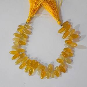 ลูกปัดหินแคลเซโดนีสีเหลืองธรรมชาติทรงข้าวเรียบ สำหรับทำเครื่องประดับ ขายส่ง - Product Image 1