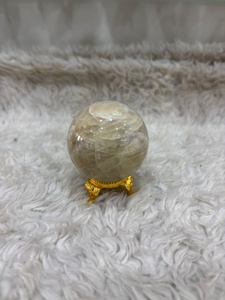 Cream moonstone <b>sphere</b> with soft ivory coloring subtle sheen rounded contours smooth polishing and refined mineral appeal - Product Image 2