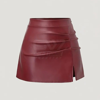 Jupe mini en cuir bordeaux taille haute pour femme, avec fente latérale et design froncé, mode féminine, OEM ODM personnalisé