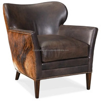 Fauteuil en cuir de luxe avec structure robuste, assise confortable et rembourrée, design élégant, parfait pour le salon ou la salle de séjour.