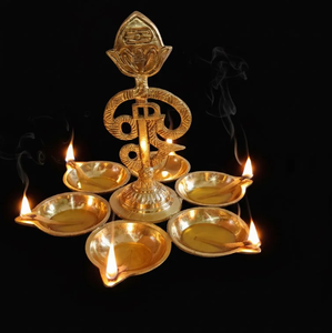 Carved brass <b>elephant</b> motif diya stand pair for sacred rituals and gifting, available at wholesale prices. - Product Image 2