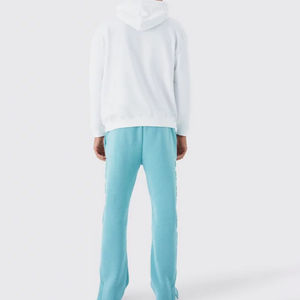 กางเกงจ็อกเกอร์ผู้ชายคุณภาพสูง 100% พร้อมโลโก้ 3 มิติแบบนูน กางเกงวอร์มทรงขาบานผ้าเฟรนช์เทอร์รี่แบบยืดหยุ่นสำหรับผู้ชาย - Product Image 3