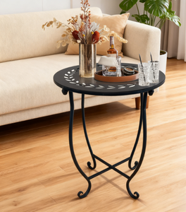 Support décoratif pour plantes en métal noir avec plateau rond découpé en forme de feuille, pieds courbés et base en X robuste, idéal pour les fleurs - Product Image 2