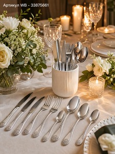 Luxury <b>silver</b> stainless steel flatware set featuring embossed <b>ornate</b> scroll handles and <b>mirror</b> polished heads displayed - Product Image 1