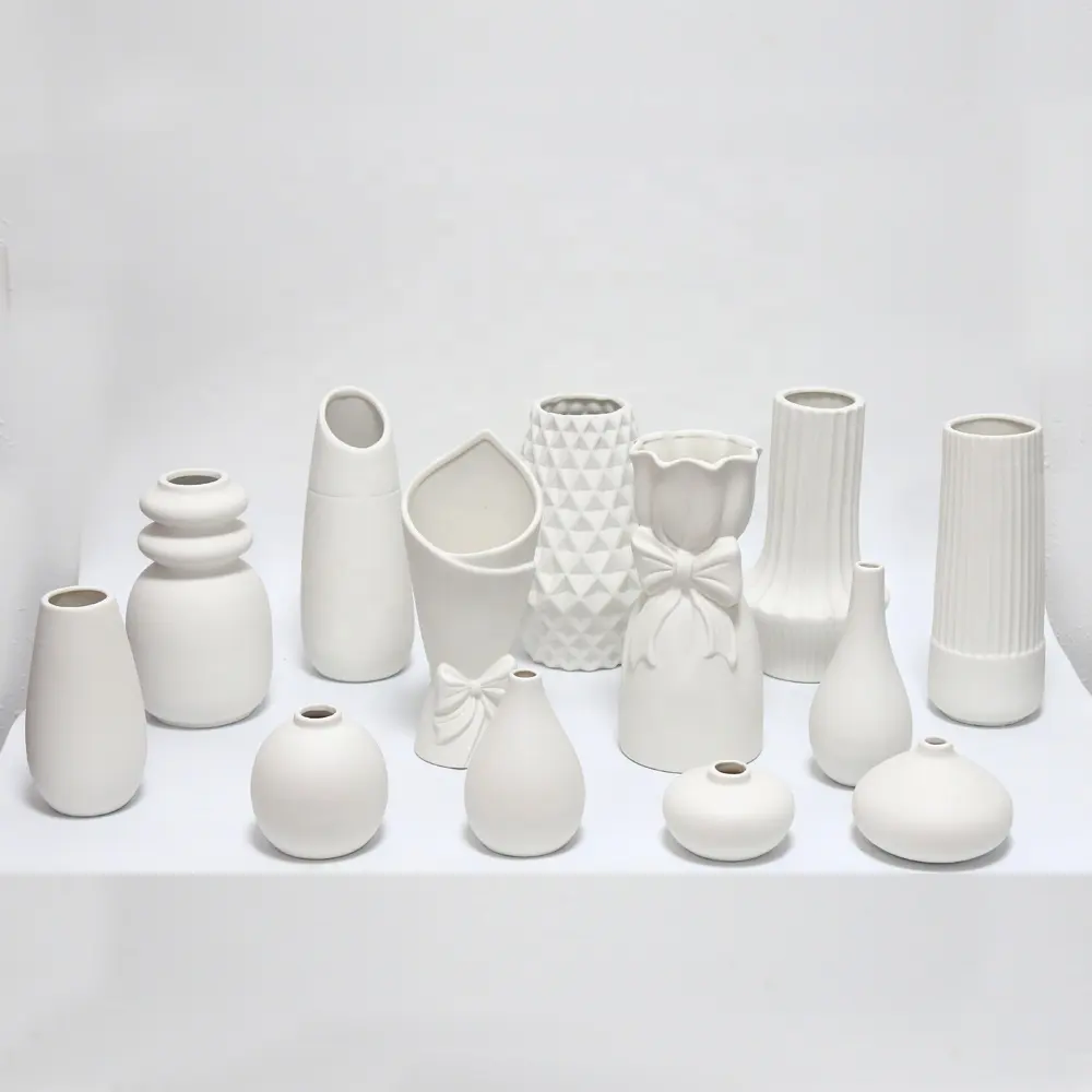 Jarrón de porcelana blanca mate de diseño moderno Jarrón de mesa popular para uso diario para decoración del hogar