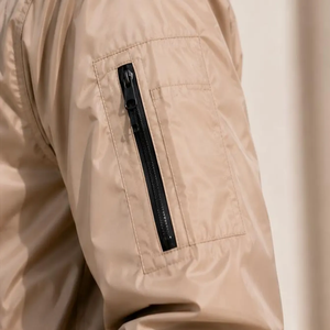 Ensemble de survêtement unisexe beige coupe-vent respirant en nylon, veste à capuche zippée et pantalon, couleur unie décontractée, manches longues, pour l'été - Product Image 3