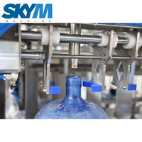 Machine de remplissage d'eau automatique pour fûts en plastique de 5 gallons, contrôlée par PLC, machine 3-en-1 de lavage, remplissage et bouchage