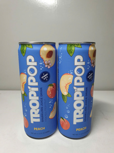 Refresco de melocotón marca TropiPop, lata de 330 ml con vitaminas A, B y C, elaborado con fruta fresca. - Product Image 2