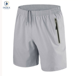 กางเกงขาสั้นผู้ชาย INDEX APPAREL สีพื้น เอวกลาง มีเชือกผูก เอวปรับได้ แห้งเร็ว เหมาะสำหรับเล่นกีฬา มีกระเป๋าซิป - Product Image 1
