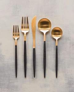Luxury <b>flatware</b> <b>set</b> featuring a matte gold finish and white marble-patterned tapered handles - Product Image 3