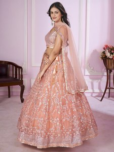 This peach pink lehenga choli blends soft elegance with heavy embroidery Perfect for creating a dreamy festive look - Product Image 2