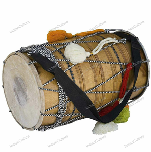 Dholak en bois naturel avec lacets traditionnels en corde, pompons décoratifs blancs et colorés, et une sangle de transport noire. - Product Image 1