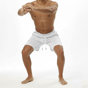 Shorts tricotés unisexes à pois blancs avec cordon de serrage à la taille et poches zippées, coupe décontractée et respirante - Product Image 5