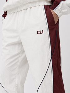 Survêtement color block de haute qualité avec logo brodé personnalisé, veste coupe-vent imperméable à fermeture éclair intégrale et pantalon de survêtement à empiècements contrastants - Product Image 4