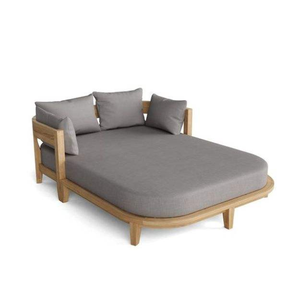 The Anderson Teak Coronado Daybed features a natural teak frame with distinctive curves and plush grey Sunbrella <b>cushions</b>. - Product Image 3