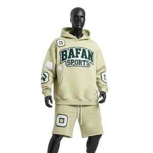 ชุดเซ็ตฮู้ดดี้และกางเกงขาสั้นผ้าฝ้ายฟลีซพรีเมียม 320 GSM สีเขียวเซจ แต่งแพทช์เชนีล ปักโลโก้ตามสั่ง - Product Image 1