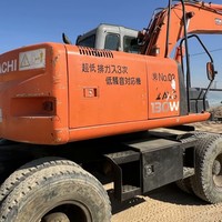 Garantie de satisfaction - Excavatrice sur pneus d'occasion HITACHI ZX130W avec une grosse réduction à vendre