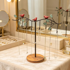 Vintage branch-style jewellery <b>stand</b> with red <b>birds</b> and leaf accents on a round wooden base, available at wholesale prices. - Product Image 1