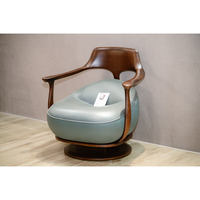 Fauteuil pivotant moderne en bois de noyer, revêtement en cuir noir, fauteuil de détente, base en métal doré, mobilier d'hôtel PISANO