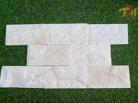Meilleure offre Pierre naturelle blanche laiteuse Carreaux muraux bruts à face fendue Panneaux de revêtement décoratifs pour l'extérieur et l'intérieur d'une villa de villégiature