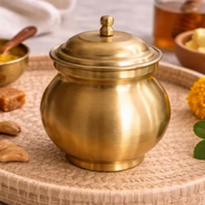 Solid brass ghee <b>pot</b> boasting a distinct brushed metal texture and a matching slotted spoon. Available at wholesale price. - Product Image 4
