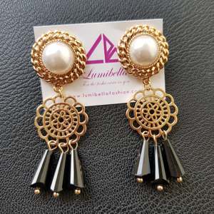Gold Plated Bohemian Drop Earrings with Black Charms and Pearl Accents - Product Image 1