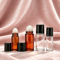 Flacon roll-on en verre épais rechargeable de 30 ml/50 ml avec bouchon à vis, rouleau en pierre, estampage à chaud doré et sérigraphie pour huiles essentielles et soins de la peau