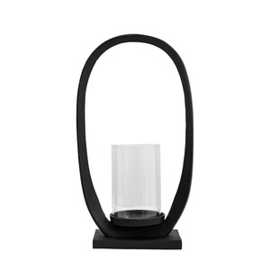Porte-bougie ovale en métal noir de style moderne avec insert cylindrique en verre pour une décoration et un éclairage contemporains. - Product Image 1
