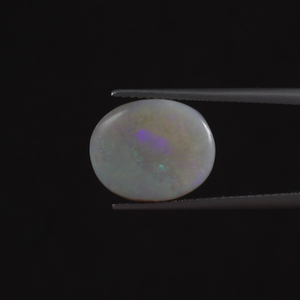 โอปอลธรรมชาติสีขาวคุณภาพดี รับรองโดย IGI น้ำหนัก 6.21 กะรัต รูปทรงวงรี ขนาด 13.5x11 มม. ตัดด้วยมือ ขัดเคลือบแว็กซ์/น้ำมัน สีอ่อน - Product Image 1