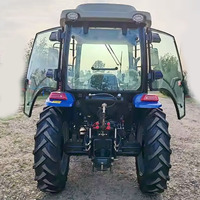 Tracteur économique 70 CV à quatre roues motrices, modifié avec une pelle frontale et une pelle arrière intégrées