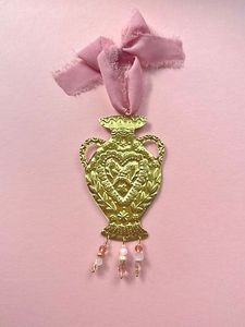 Features an elegant handcrafted finish with intricate detailing, making each ornament a unique decorative piece. - Product Image 1