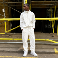 Survêtement blanc personnalisé OEM à marque privée, respirant, avec fentes latérales, fermeture métallique, col montant, pantalon de jogging, fabricant designer