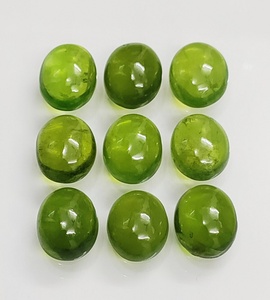 พลอยเวสโซไนต์สีเขียวธรรมชาติคุณภาพ AAA ขนาด 12*10 มม. รูปทรงคาโบชองรูปไข่ พลอยแท้ 100% สำหรับทำเครื่องประดับ - Product Image 3