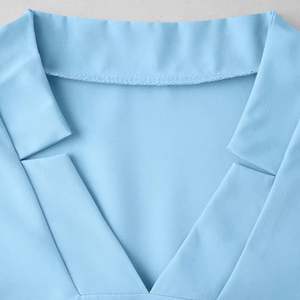 Conjunto de Uniformes Médicos Unisex: Blusa Quirúrgica con Cuello en V y Ajuste Elástico, Pantalones Jogger, Multibolsillos, Tela de Lona, Sin Costuras, con Protección Contra Agujas - Product Image 2