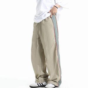 Pantalon coupe-vent personnalisé pour femme avec logo, pantalon de survêtement en nylon respirant pour femme avec empiècements latéraux, idéal pour l'été - Product Image 3