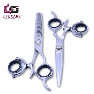 Ciseaux de coiffeur professionnels avec poignée à anneau pivotant Ciseaux de coiffure et d'amincissement de haute qualité fabriqués par Life Care Instruments. - Product Image 1