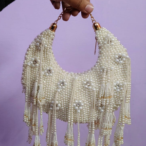Elegant Ivory Pearl <b>Beaded</b> Crescent Shape Handbag with Heavy Tassel <b>Fringe</b> Detailing Handcrafted Bridal Potli Style Shoulder Bag - Product Image 1