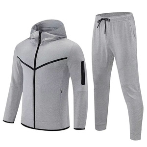 Elite men's two-piece tracksuits. Dynamic color-block zip jackets paired with sleek matching <b>pants</b> for peak performance. - Product Image 4