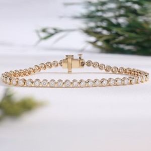 Trendy Yellow Gold Diamond Tennis Bracelet Round Cut Bezel Setting Sparkling Diamond Bracelets For Women and <b>Men</b> for daily wear. - Product Image 1